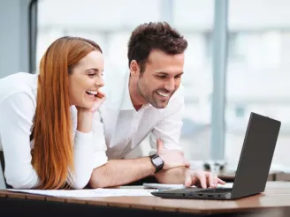 man and woman at computer